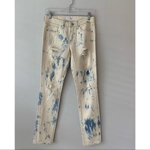 White and blue tie dye jeans with rips
